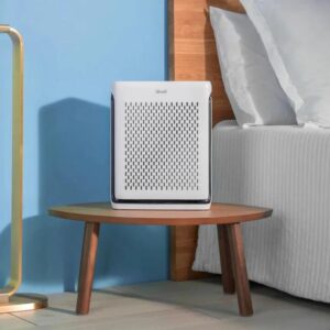 Vital 100S Air Purifier On Table Next To Bed. Credit: Levoit